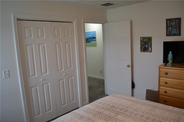 carpeted bedroom featuring a closet