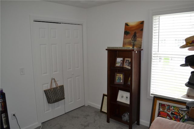 interior space featuring light colored carpet