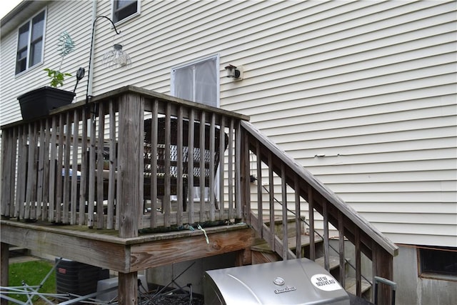 wooden terrace featuring central AC unit