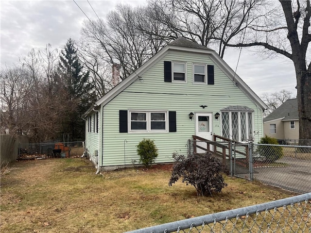 bungalow-style home with a front yard