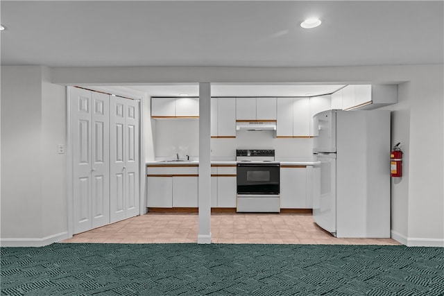 kitchen featuring white appliances, light colored carpet, white cabinetry, and sink