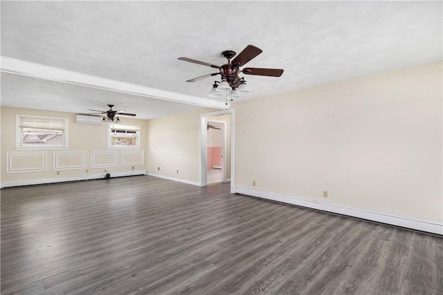 unfurnished living room featuring dark wood-type flooring, a wall unit AC, and a ceiling fan