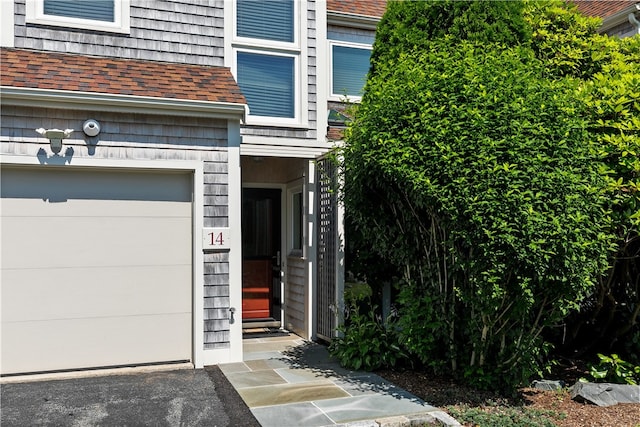 property entrance with a garage