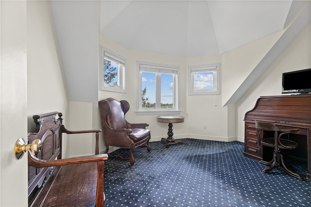 living area featuring carpet flooring and lofted ceiling