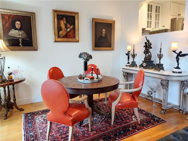 dining room with hardwood / wood-style floors