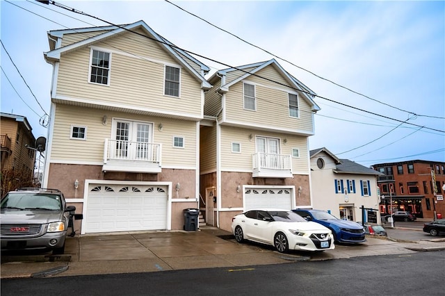 view of front of house with a balcony and a garage