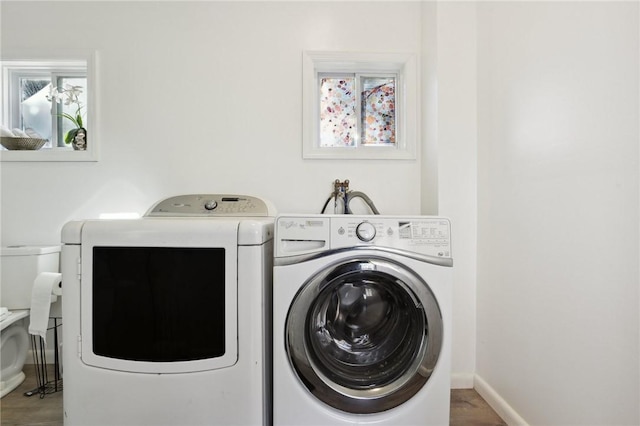 laundry room with separate washer and dryer