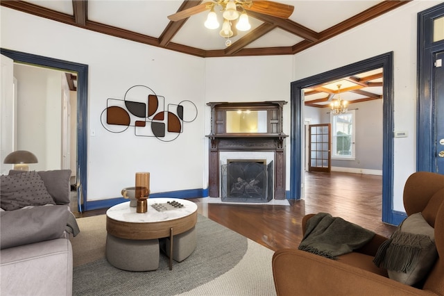 living room with beamed ceiling, ceiling fan with notable chandelier, crown molding, and dark wood-type flooring