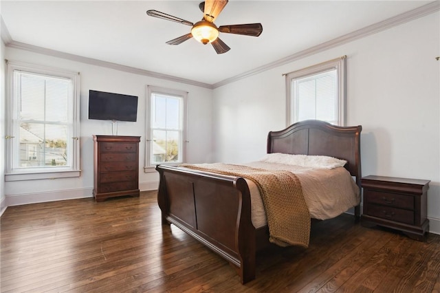 bedroom featuring ceiling fan, ornamental molding, dark wood-type flooring, and multiple windows