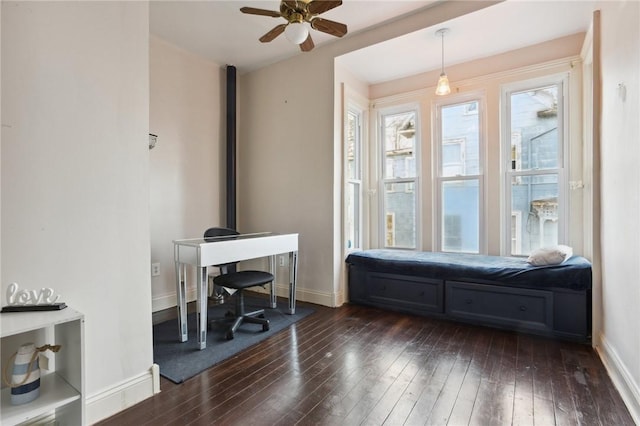 office area with ceiling fan and dark hardwood / wood-style floors