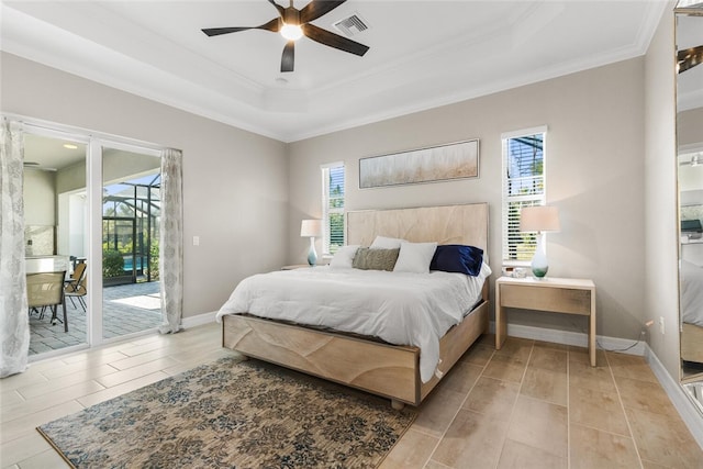 bedroom featuring a raised ceiling, ceiling fan, access to exterior, ornamental molding, and light tile patterned floors