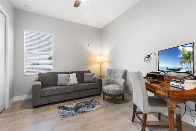 office with ceiling fan and vaulted ceiling