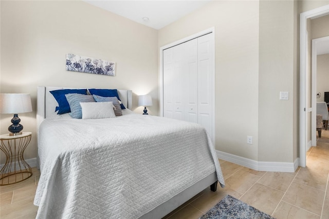 bedroom featuring a closet and tile patterned flooring