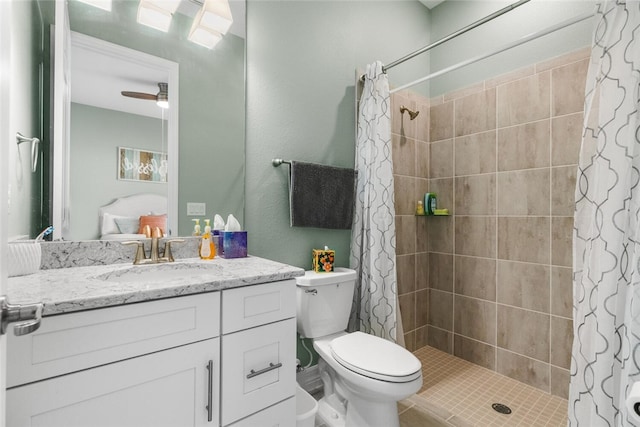 bathroom featuring ceiling fan, a shower with curtain, tile patterned flooring, toilet, and vanity