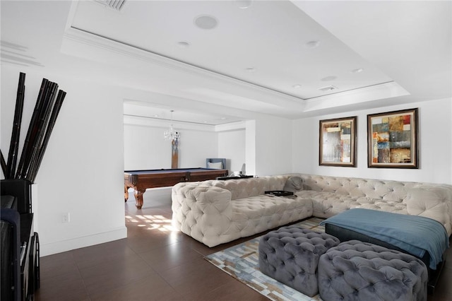 living room with crown molding, pool table, and a tray ceiling