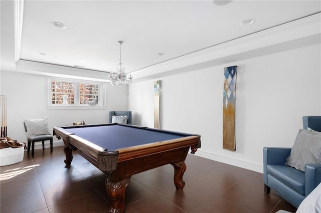 rec room featuring a raised ceiling, crown molding, pool table, and a chandelier