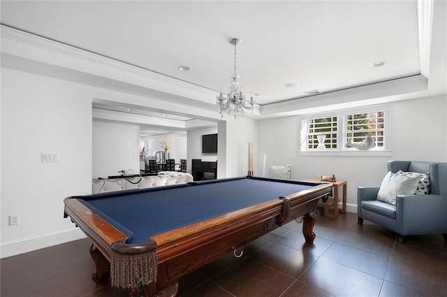 playroom with an inviting chandelier, a raised ceiling, ornamental molding, and pool table