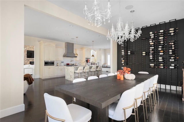 dining area with dark hardwood / wood-style flooring and a chandelier