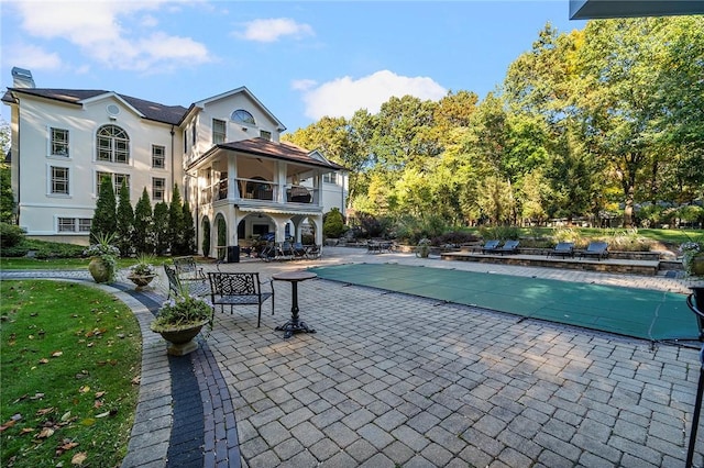 view of swimming pool featuring a patio