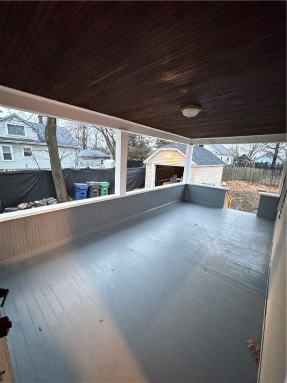 exterior space with wood ceiling and a healthy amount of sunlight