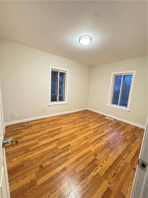 empty room featuring light hardwood / wood-style floors