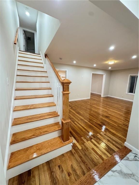 stairway with wood-type flooring