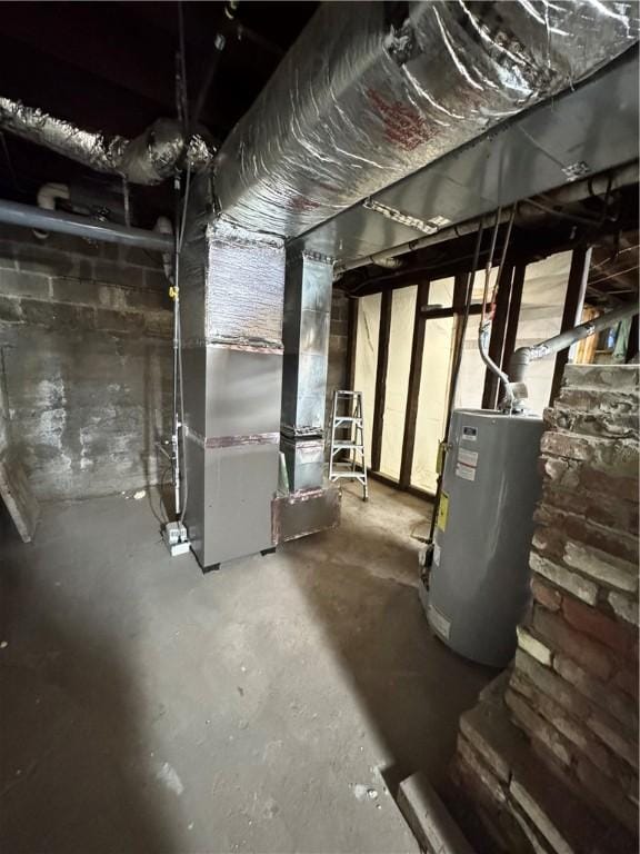 basement featuring gas water heater and heating unit