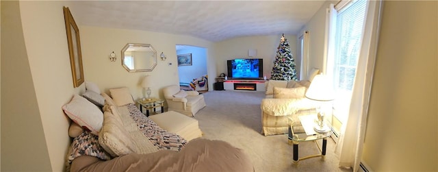 carpeted living room featuring a fireplace