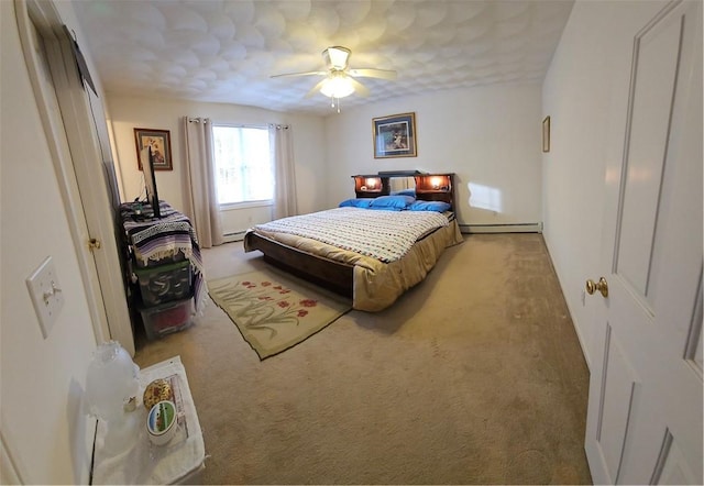 carpeted bedroom featuring ceiling fan and a baseboard radiator