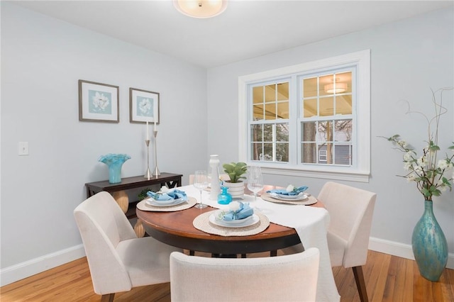 dining space featuring hardwood / wood-style floors