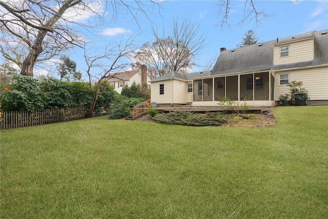 view of yard with a sunroom