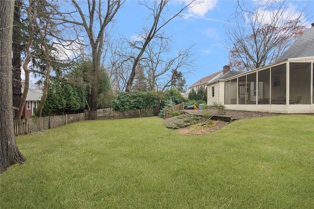 view of yard featuring a sunroom