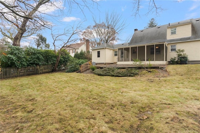 view of yard featuring a sunroom