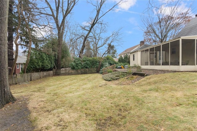 view of yard with a sunroom