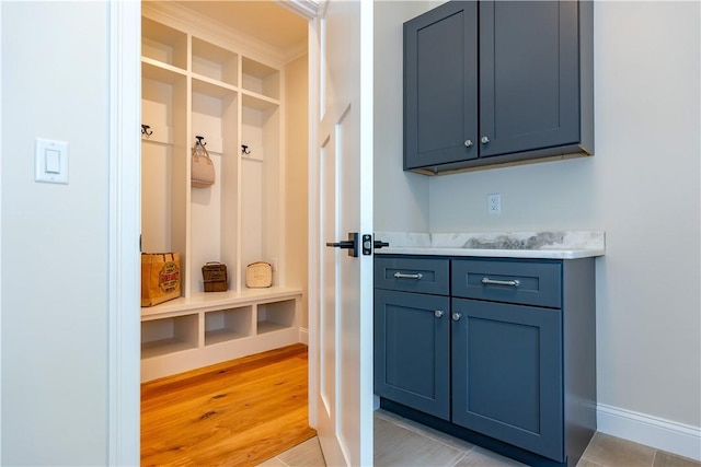 mudroom with light hardwood / wood-style floors