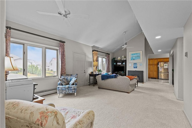 carpeted living room featuring a baseboard radiator, vaulted ceiling, ceiling fan, and a healthy amount of sunlight