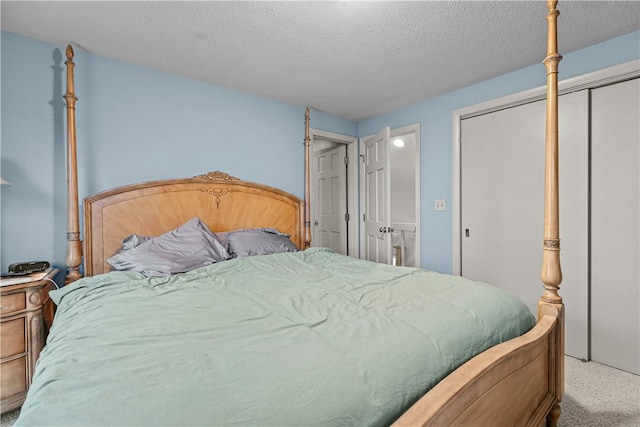 carpeted bedroom with a textured ceiling