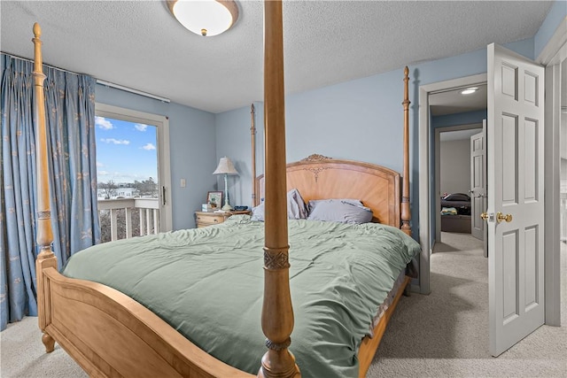 carpeted bedroom with a textured ceiling