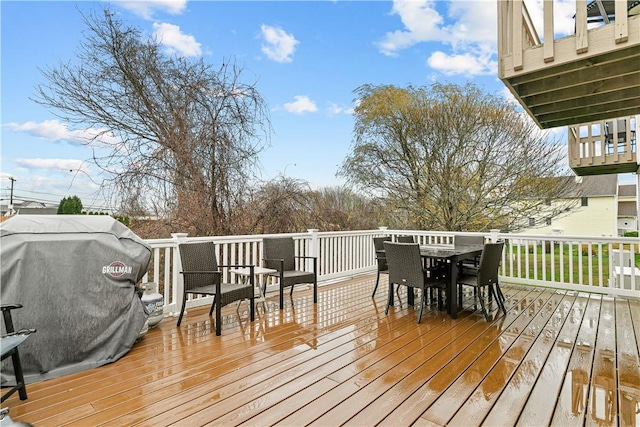 wooden terrace featuring area for grilling