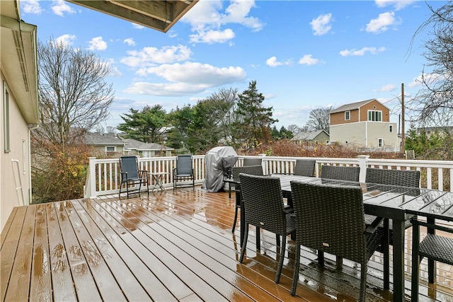 wooden terrace with area for grilling