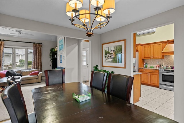 tiled dining space featuring a wall mounted air conditioner, ceiling fan with notable chandelier, and a healthy amount of sunlight