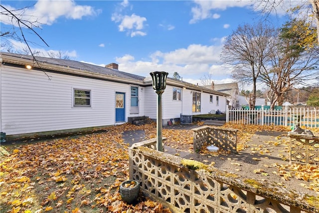 rear view of house with central AC