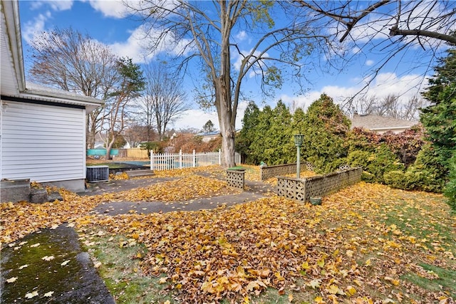 view of yard featuring central AC unit