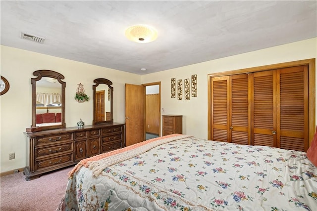 carpeted bedroom with a closet