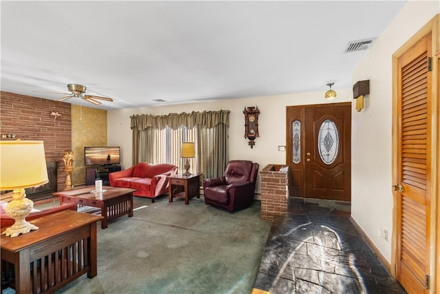 carpeted entryway featuring ceiling fan