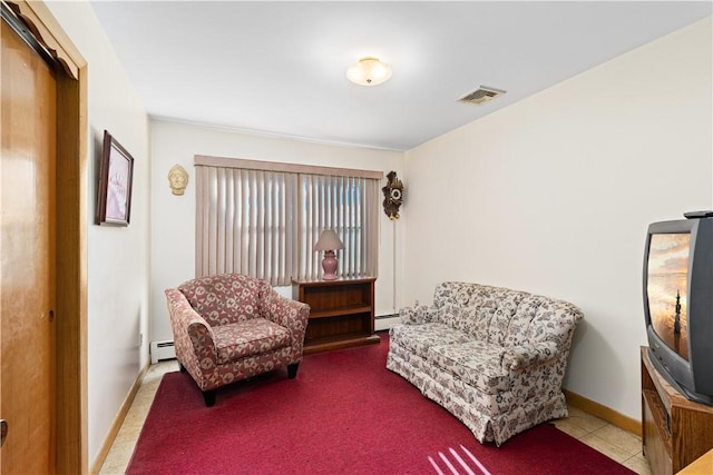 living area featuring a baseboard heating unit