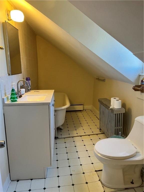 bathroom featuring a tub, radiator heating unit, a baseboard radiator, toilet, and vanity