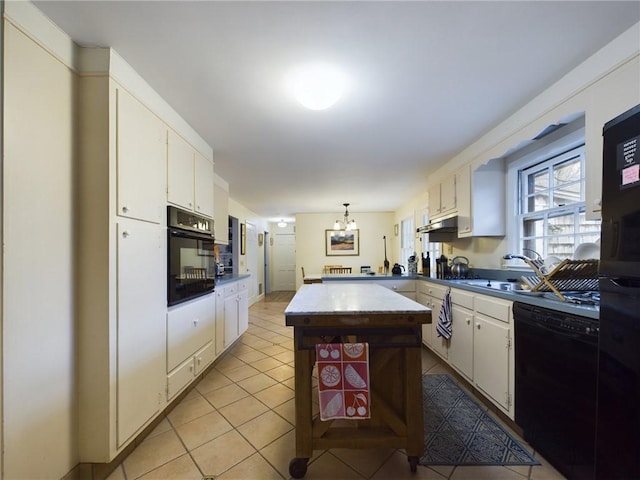 kitchen with black appliances, light tile patterned floors, decorative light fixtures, a notable chandelier, and white cabinetry