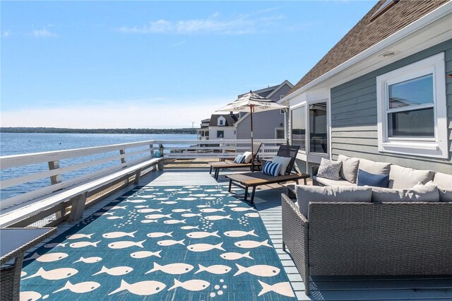 view of patio featuring a deck with water view and an outdoor living space