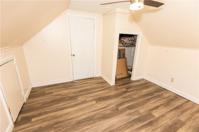 bonus room with dark hardwood / wood-style floors, ceiling fan, and vaulted ceiling